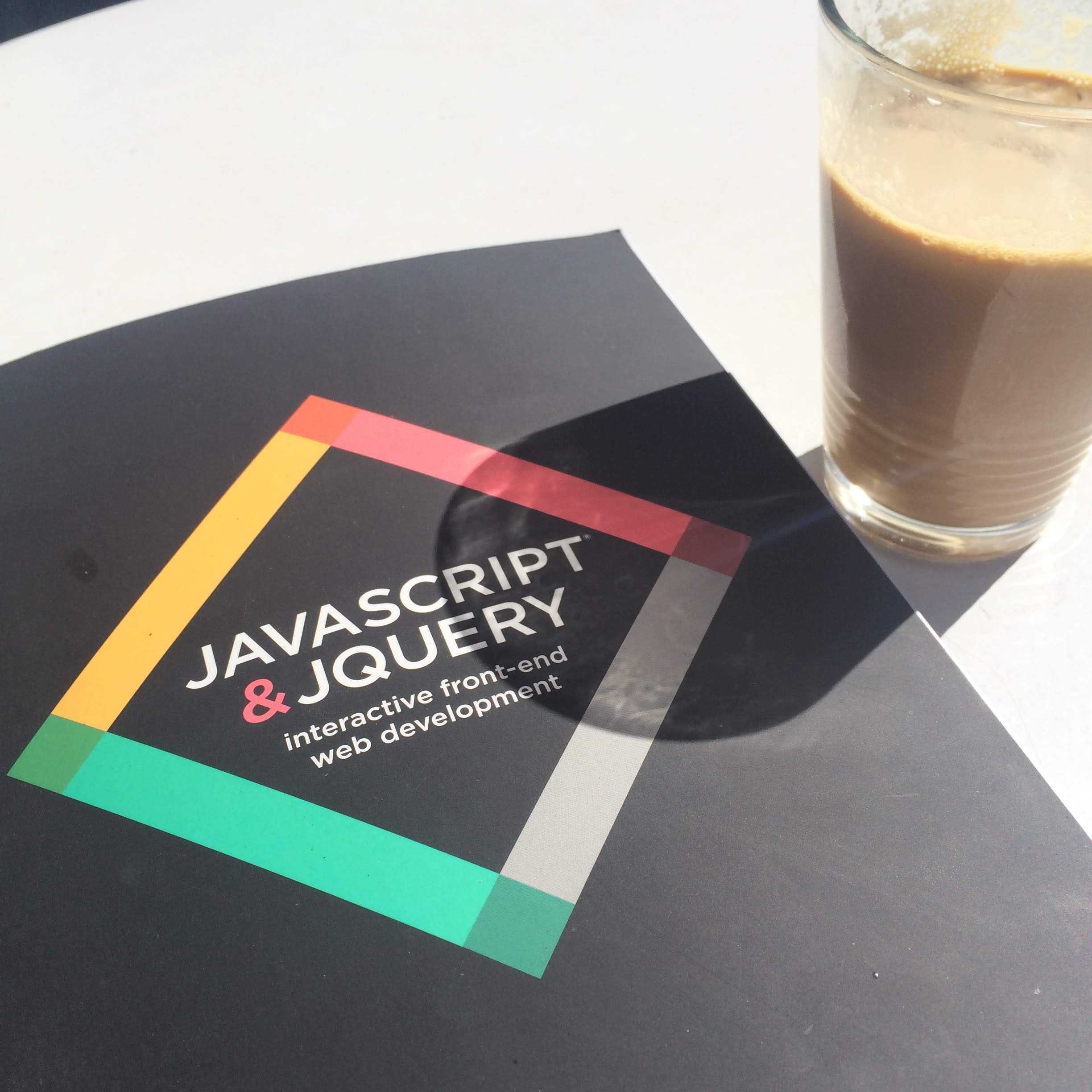 Ashley's JavaScript textbook and coffee from Summermoon coffee